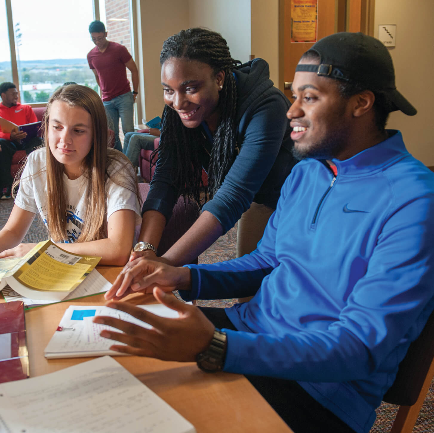 Three students reading together