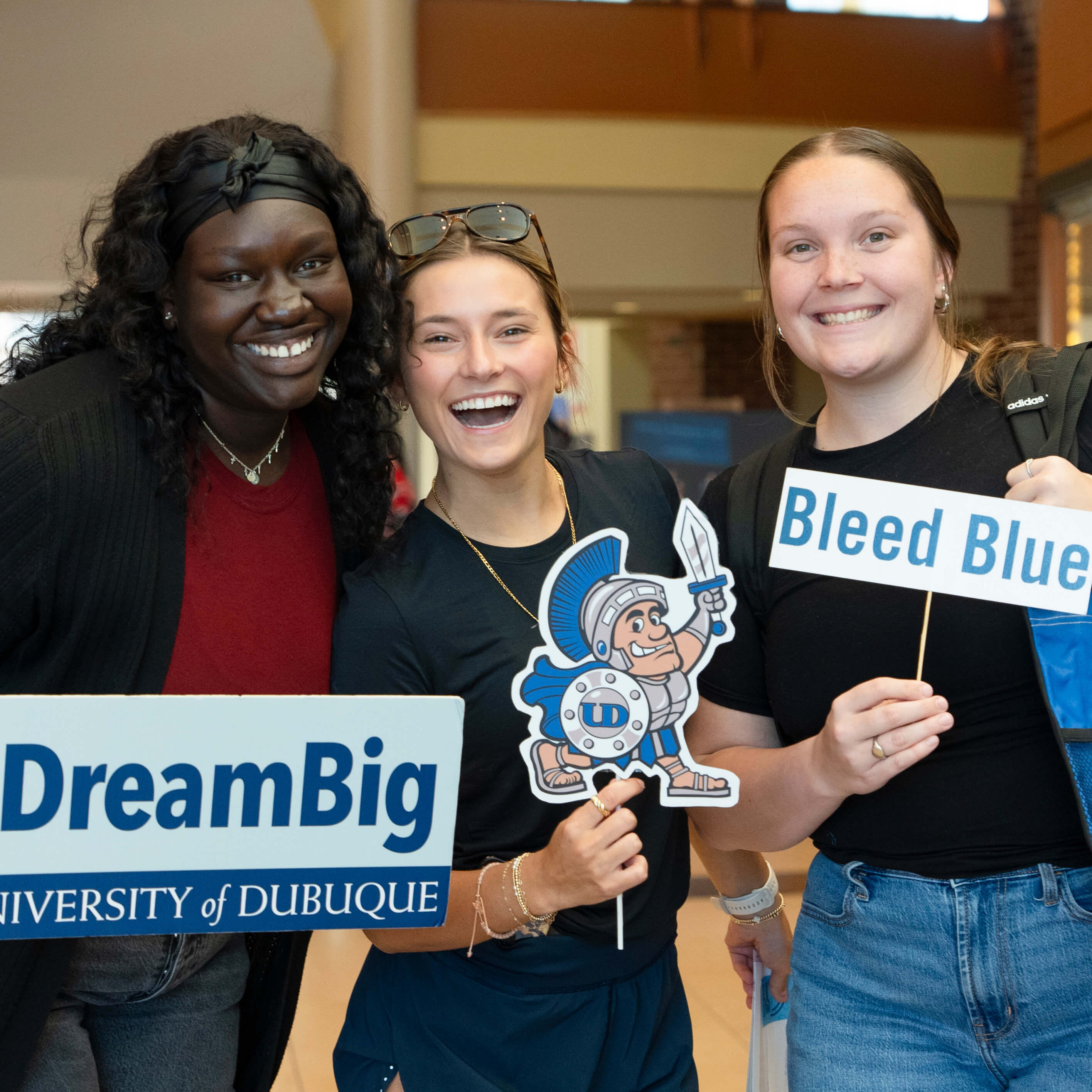 Students holding Dream Big signs